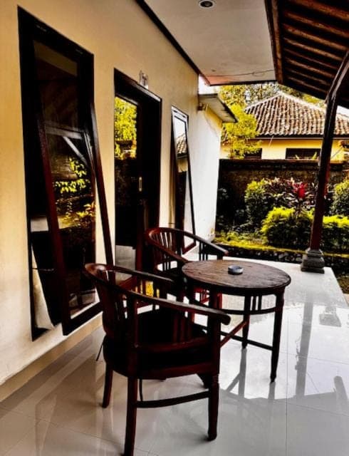 a patio with a table and two chairs and a table at House market in Sidemen