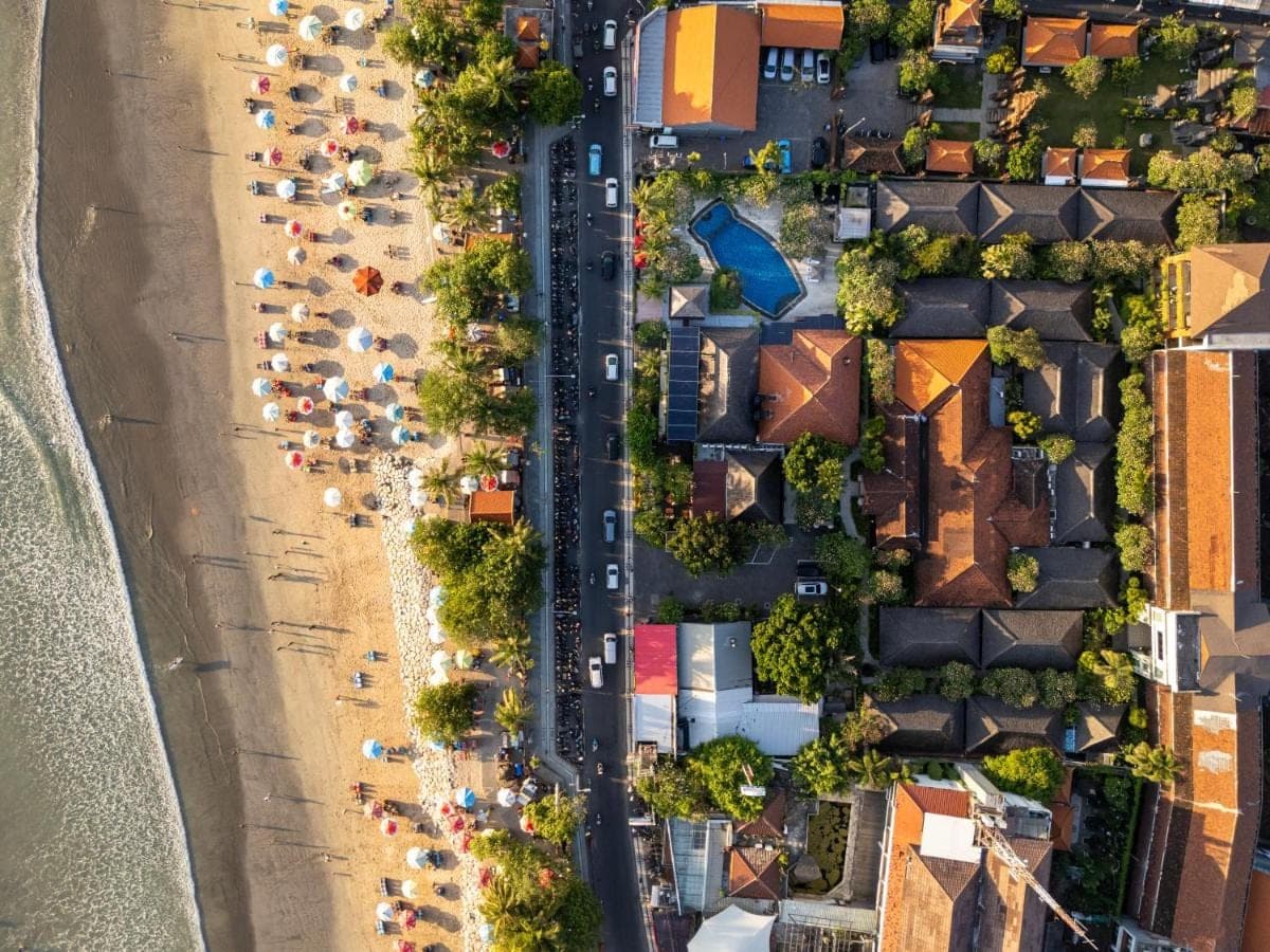 an aerial view of a beach with a parking lot at Kuta Seaview Beach Resort in Kuta