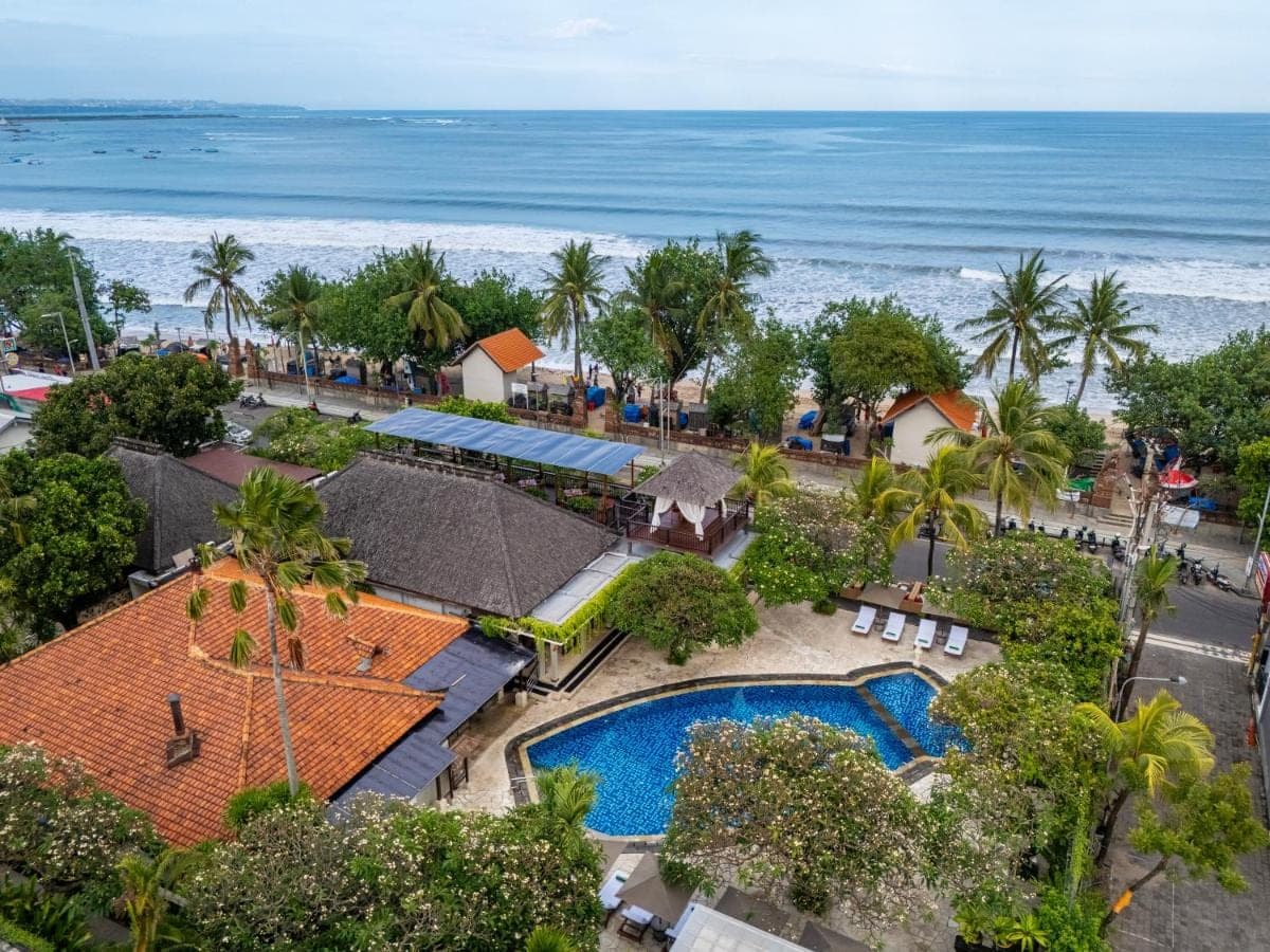 an aerial view of a resort with a swimming pool and the ocean at Kuta Seaview Beach Resort in Kuta