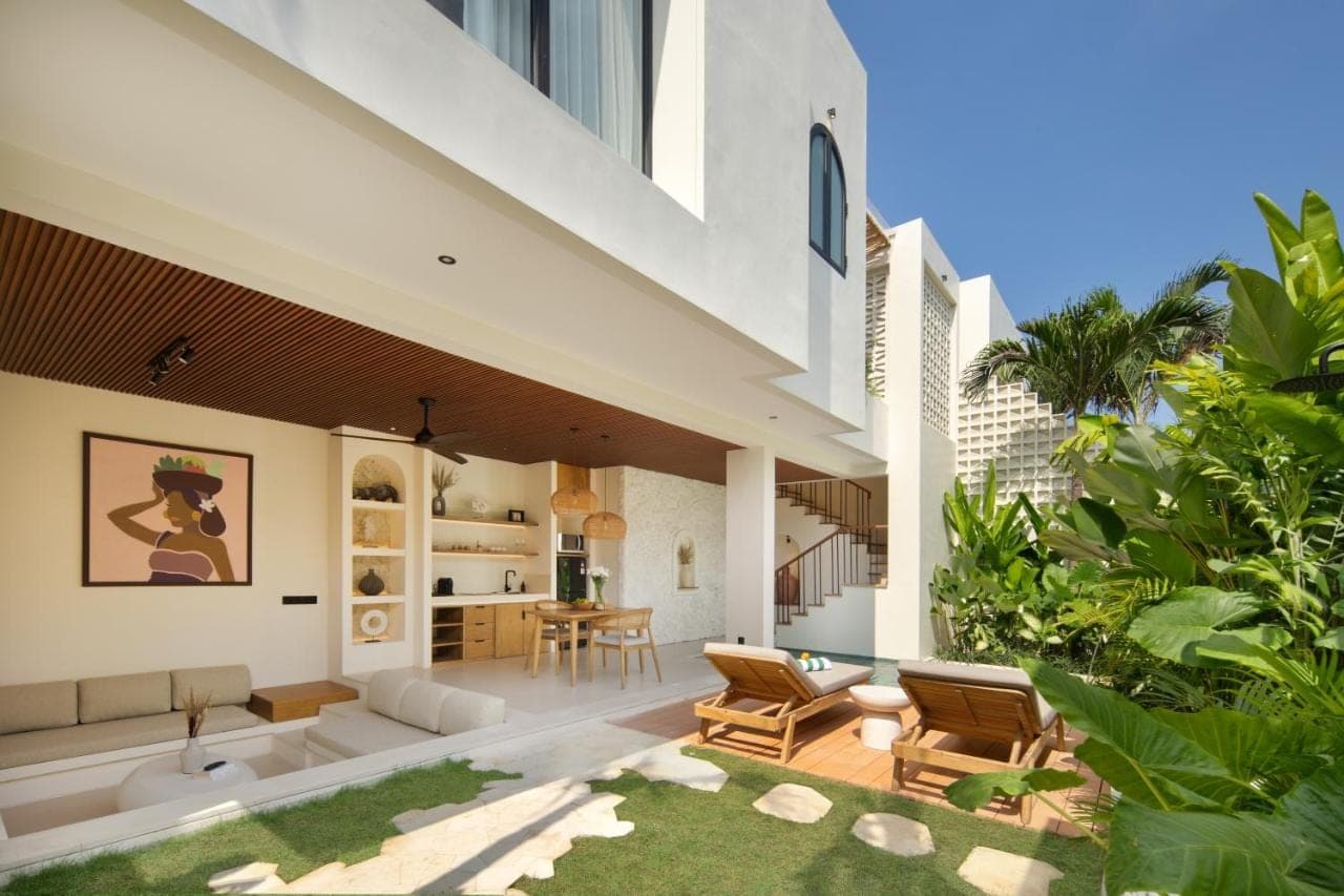an open living room and dining area of a house at Solaya Villas Canggu in Canggu