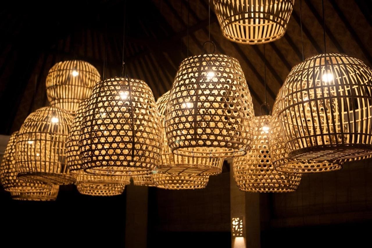 a group of chandeliers hanging from a ceiling at Pelangi Villas Sidemen by AGATA in Sidemen
