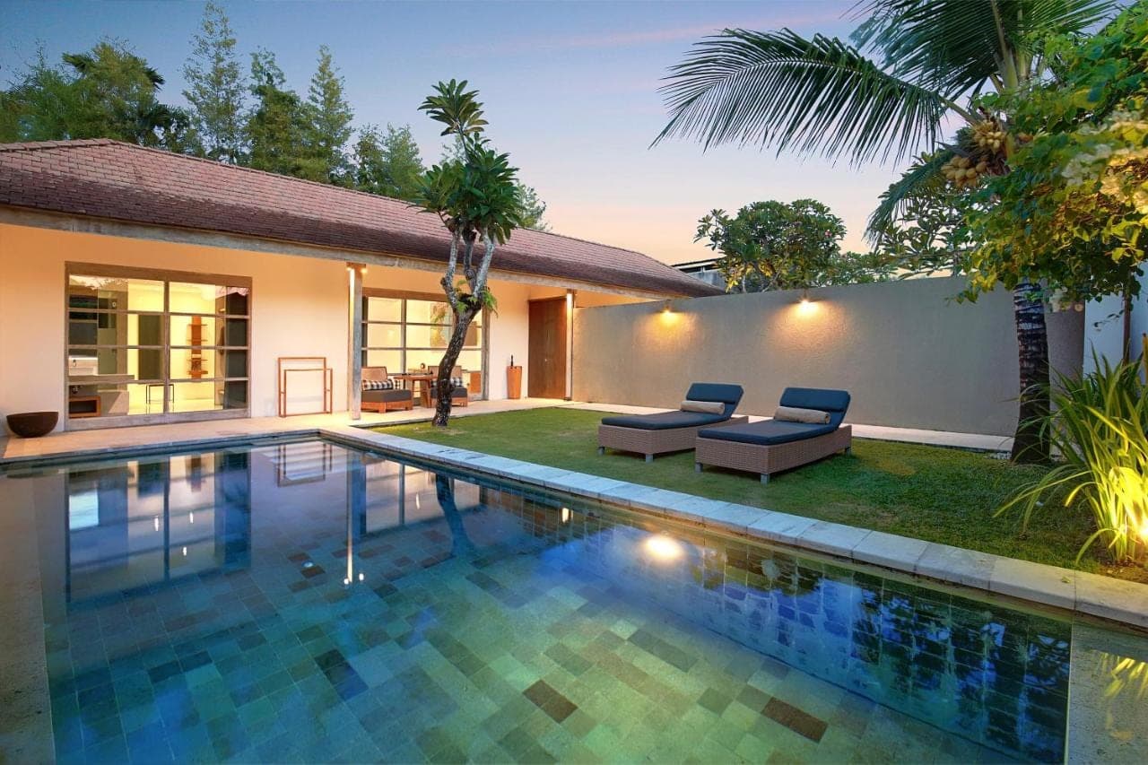 a swimming pool in the backyard of a villa at Uma Sapna Seminyak in Seminyak