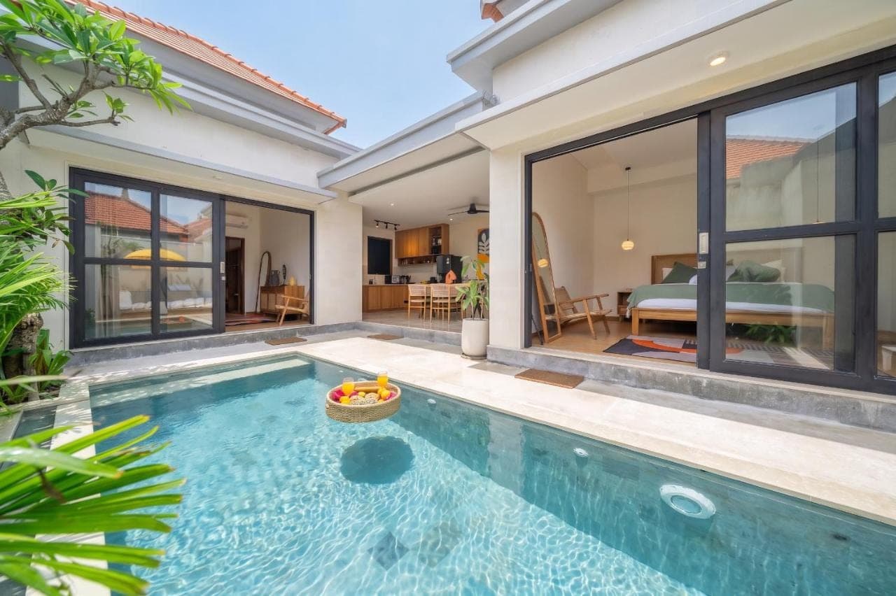a swimming pool in front of a villa at Lekatika - Spacious Pool Villa Close to Local Hotspots in Seminyak