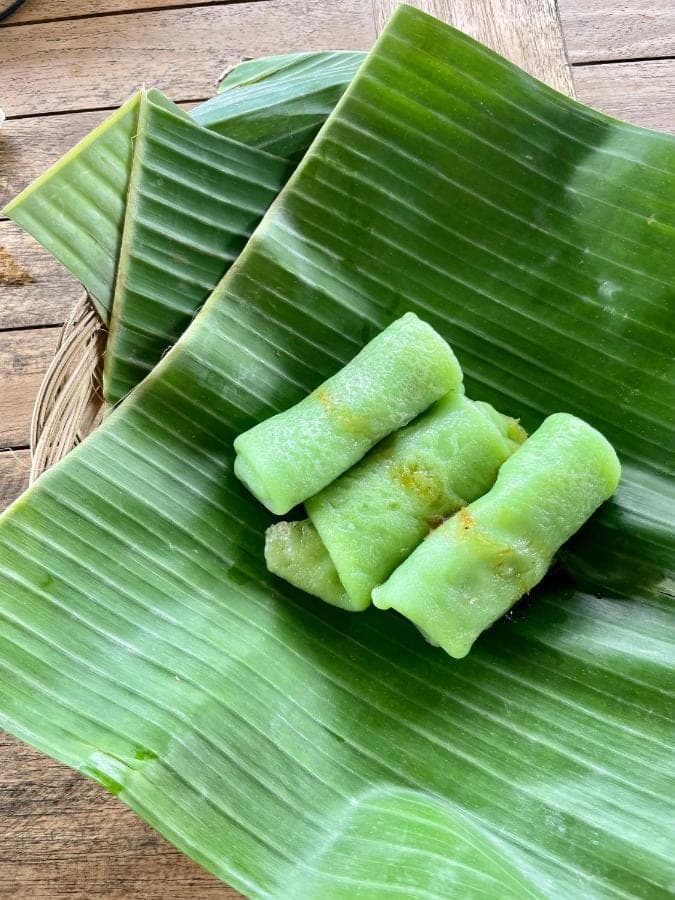 a banana leaf with three pieces of food on it at Tirta Unda Sidemen in Sidemen
