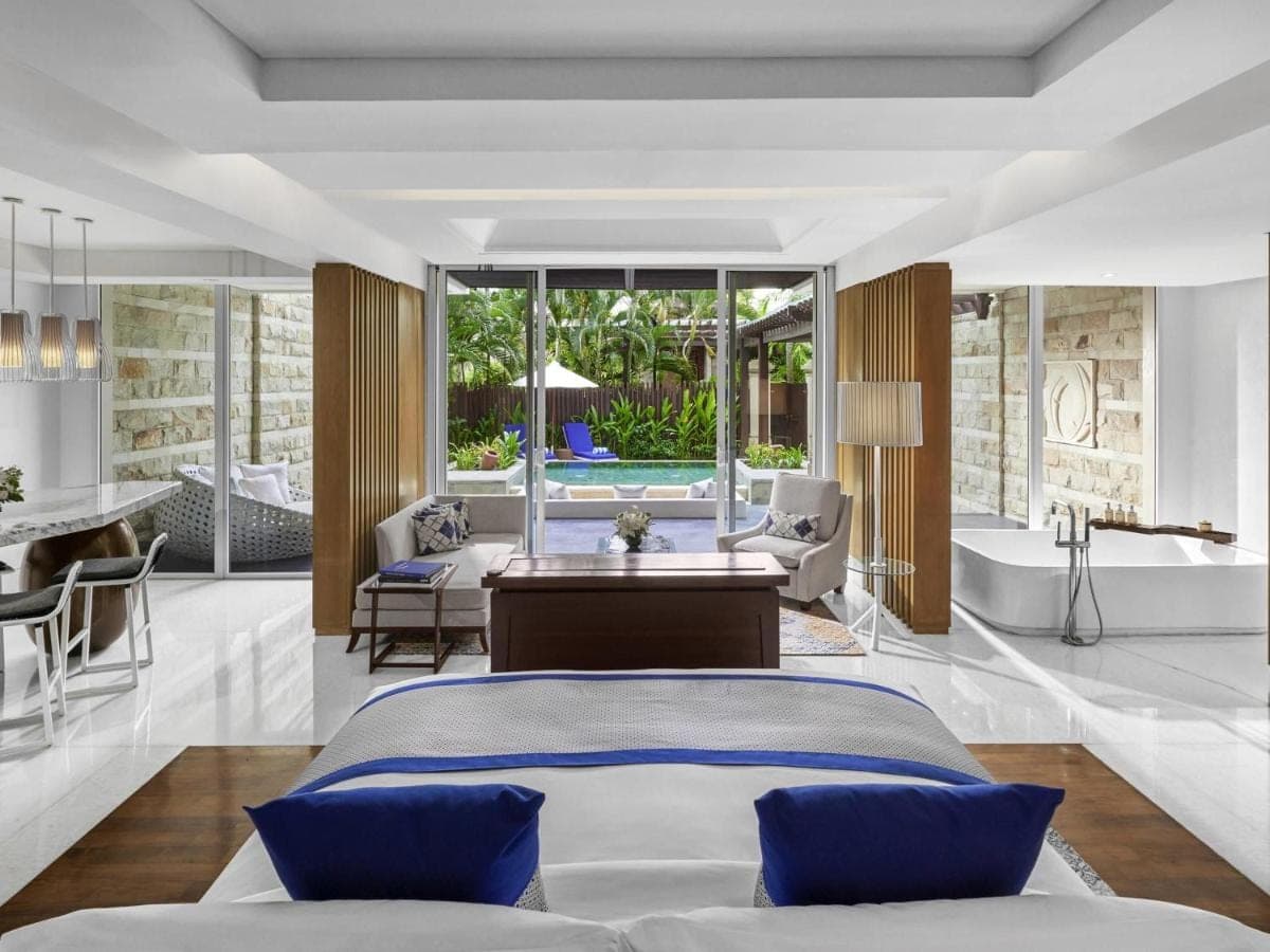 a bedroom with a bed and a living room at Sofitel Bali Nusa Dua Beach Resort in Nusa Dua