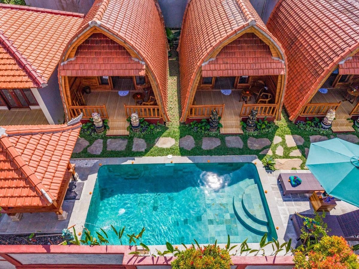 an aerial view of a house with a swimming pool at Lumbung Sari villa ubud by Dewanta Property in Ubud