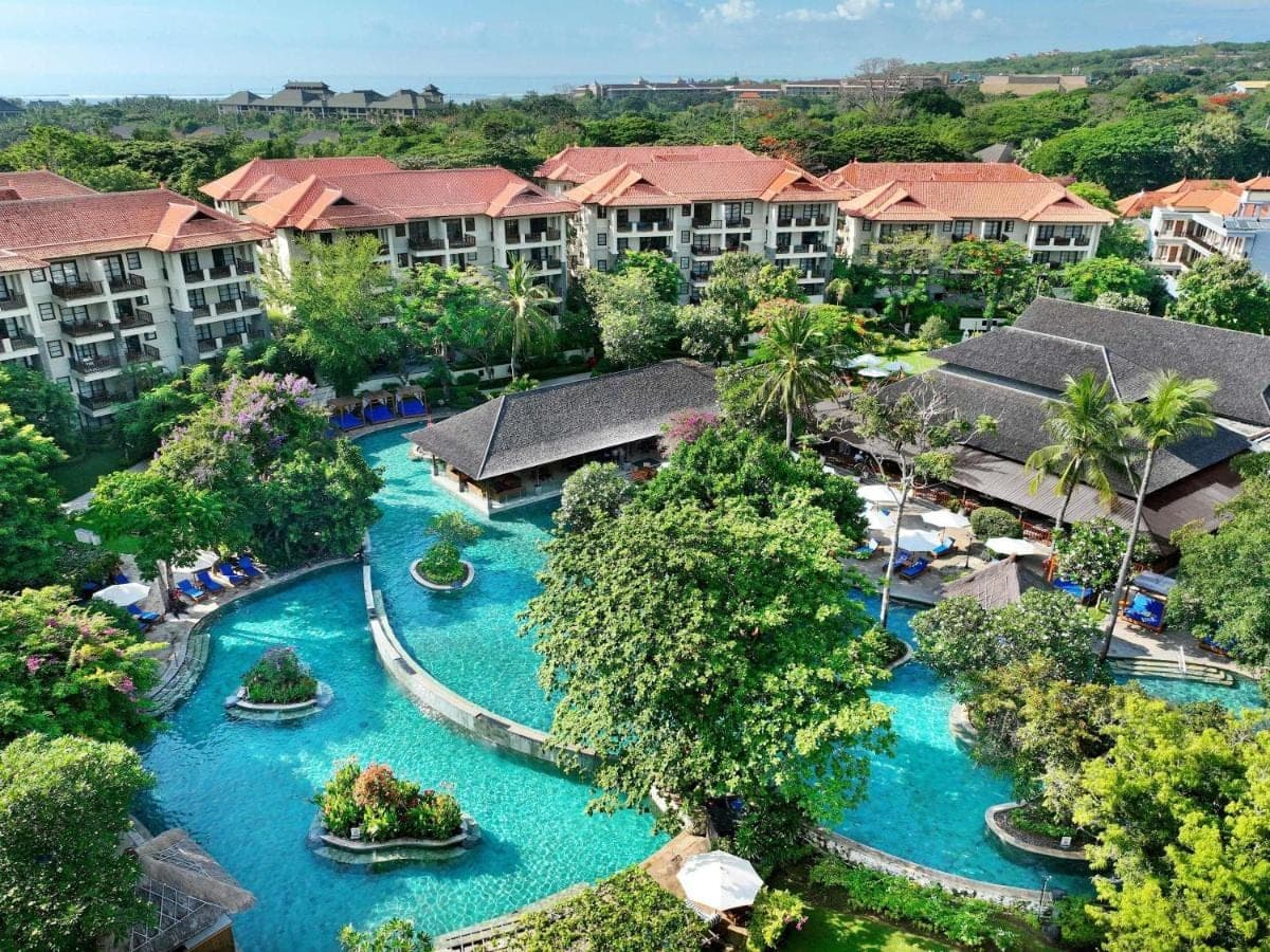 an aerial view of a resort with blue water at Novotel Bali Nusa Dua in Nusa Dua