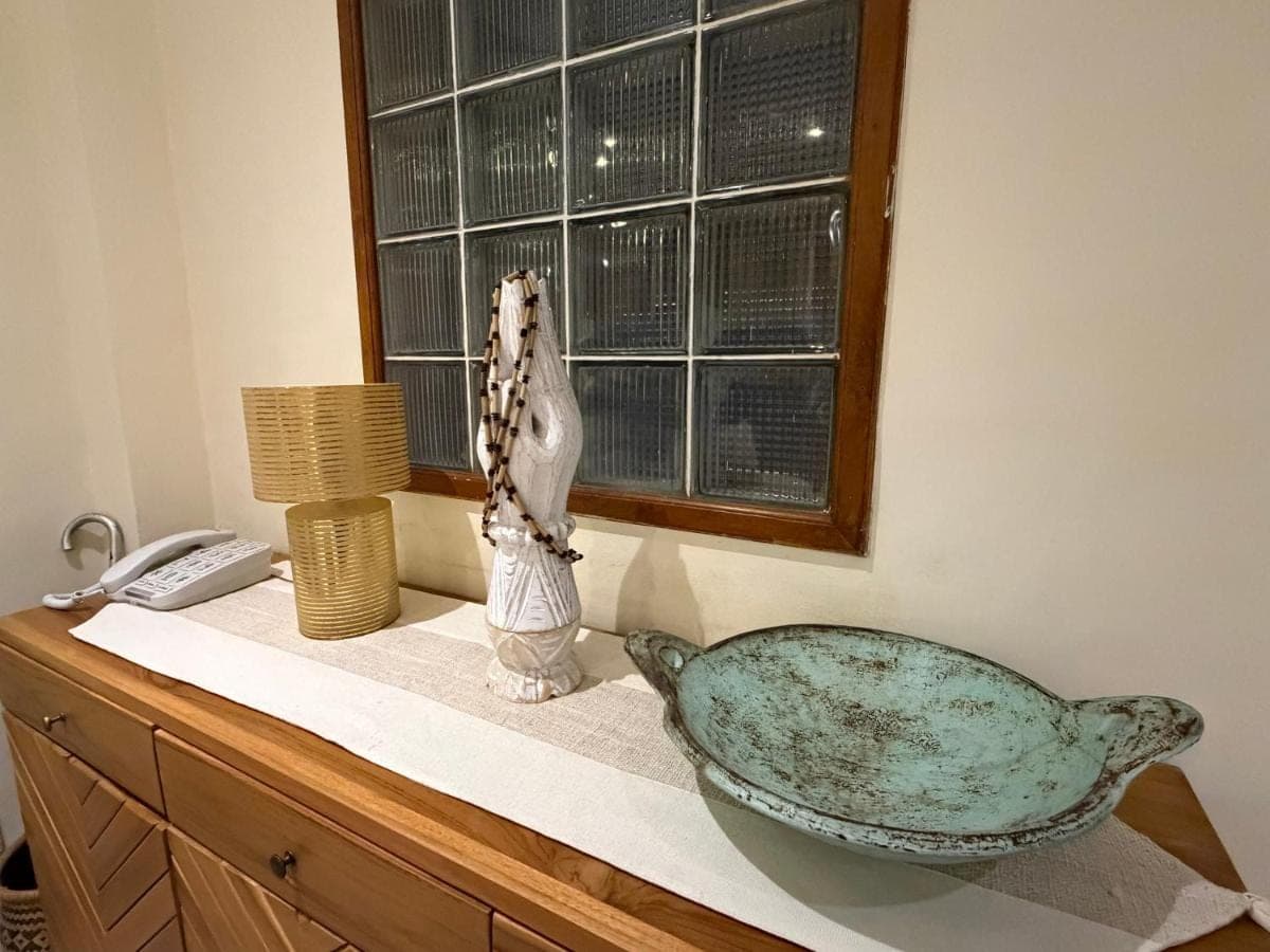 a sink sitting on a counter next to a window at Private Apartment 6505 at the Jayakarta Residence in Seminyak