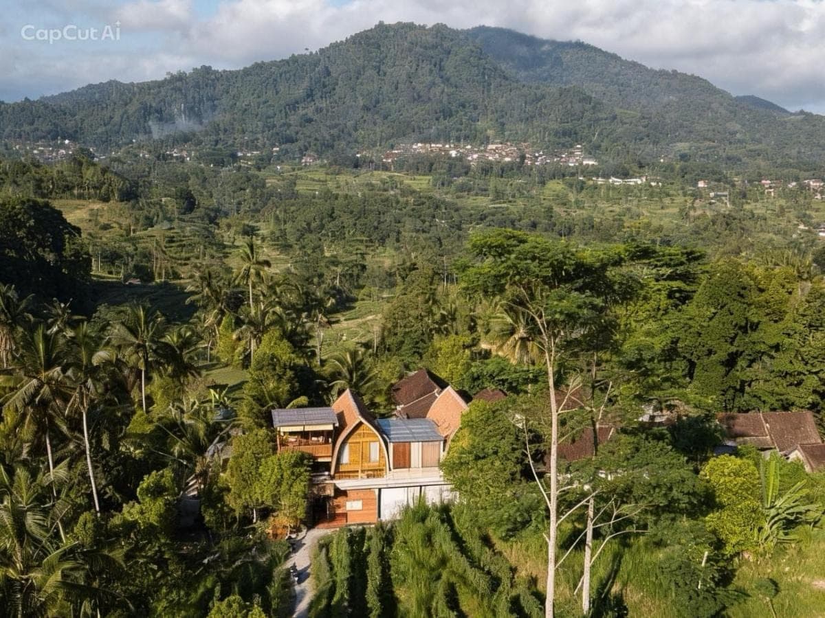 an aerial view of a house in the forest at Kubu Dangin Ogang Guest House in Sidemen