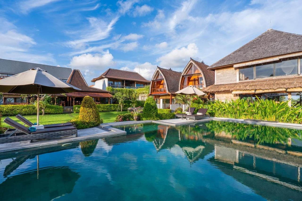 an image of a house with a swimming pool at Canggu Wooden Green Paradise in Canggu