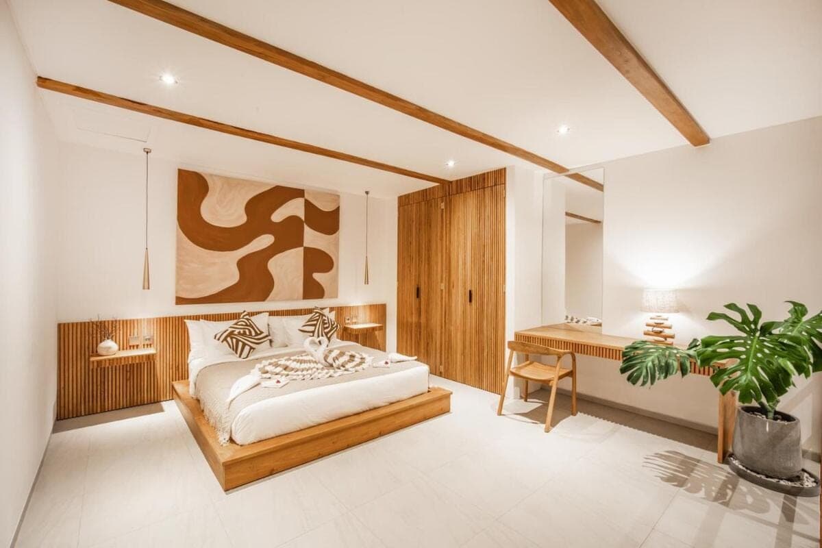 a bedroom with a bed and a desk at Pererenan Gate Brand New 1BR Retreat In Canggu in Canggu