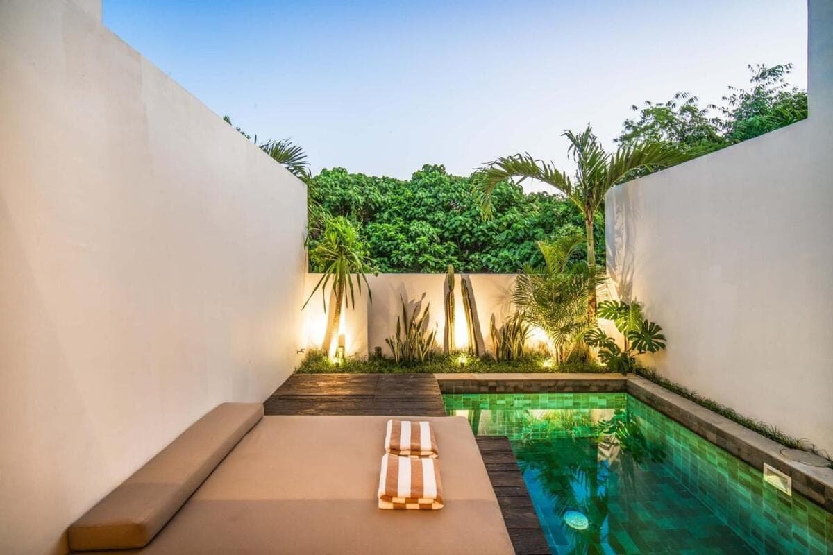 a swimming pool in the backyard of a house at Pererenan Gate Brand New 1BR Retreat In Canggu in Canggu