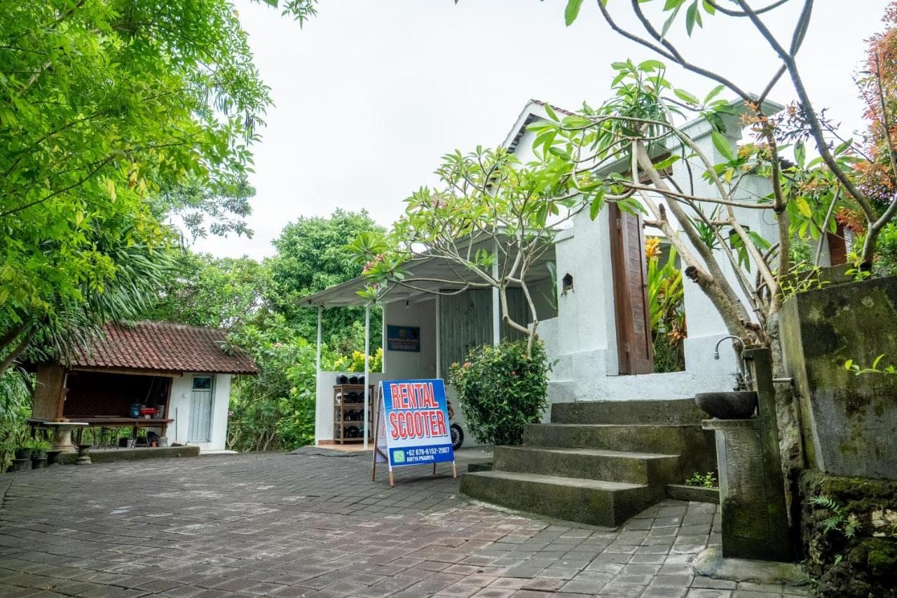 a sign in front of a building with a sale sign at Dream Breeze Village Uluwatu in Uluwatu