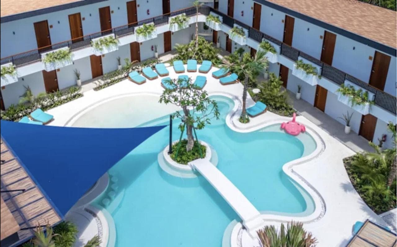 an artist rendering of the pool at a resort at Lay Day Party and Surf Hostel Uluwatu in Uluwatu