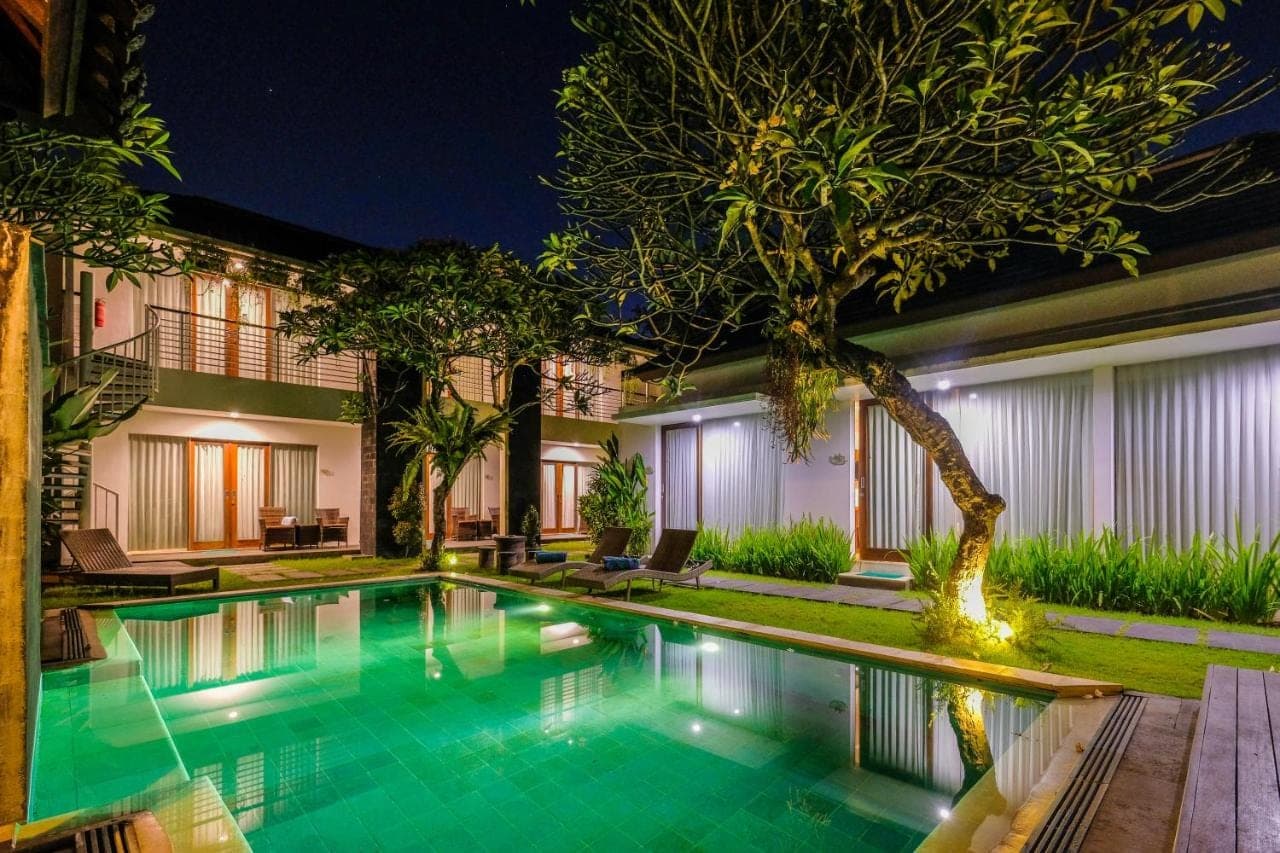 a swimming pool in a villa at night at Papillon Echo Beach in Canggu