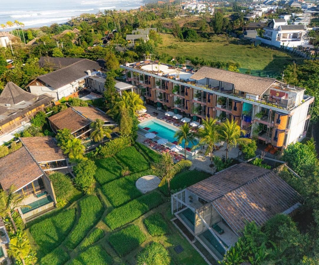 an aerial view of a resort with a swimming pool at Shore Amora Canggu in Canggu