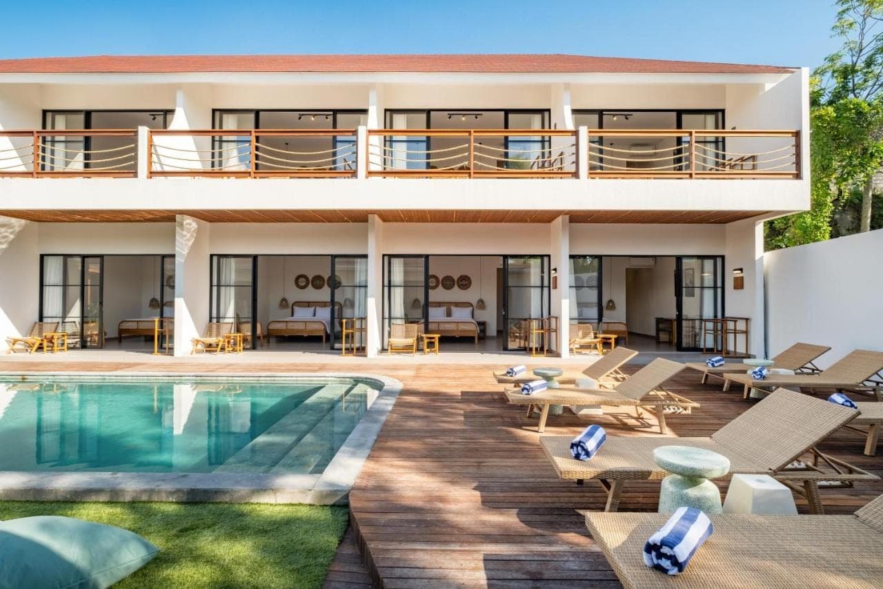 a villa with a swimming pool and a resort at CHAO Villas Rooms Recovery Spa in Uluwatu
