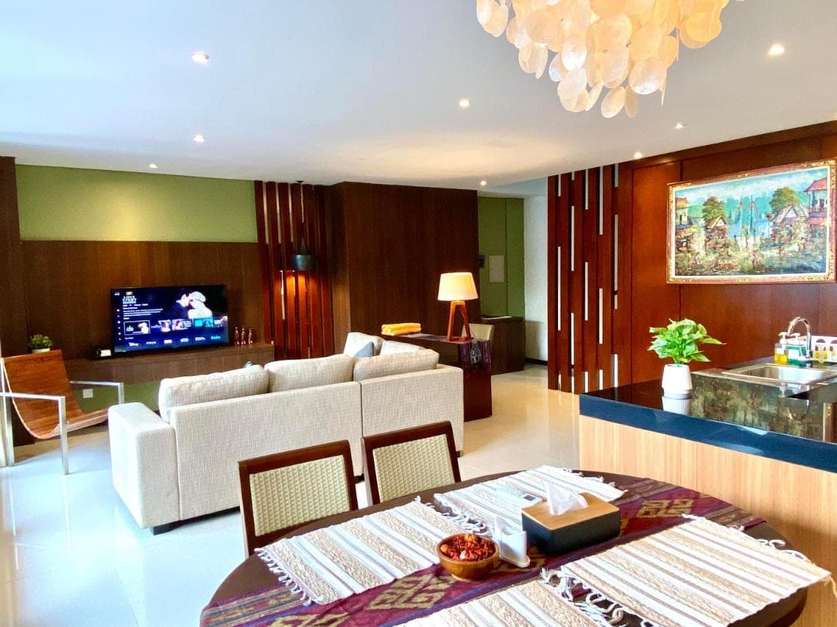 a living room with a couch and a table at Bloomingville Villas in Nusa Dua in Nusa Dua