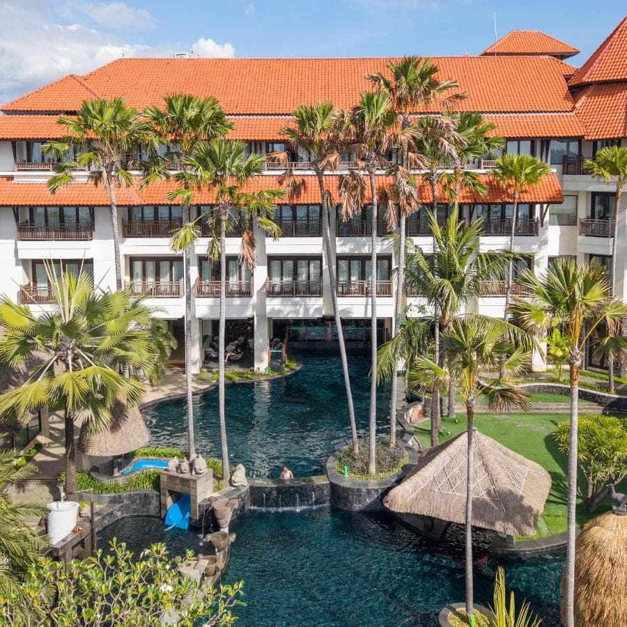 an aerial view of a resort with palm trees at Holiday Inn Resort Bali Nusa Dua by IHG in Nusa Dua