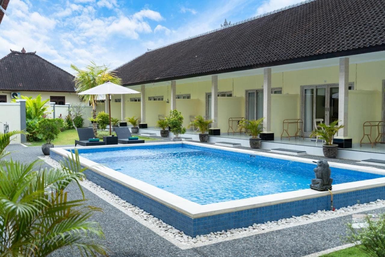 an image of a swimming pool in front of a villa at The Kifaraju Nusa Dua Bali in Nusa Dua