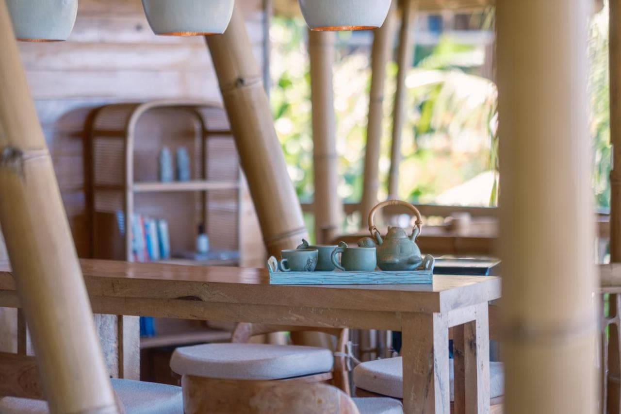 a table with a tea kettle on top of it at Villas Bukit Lipah in Amed