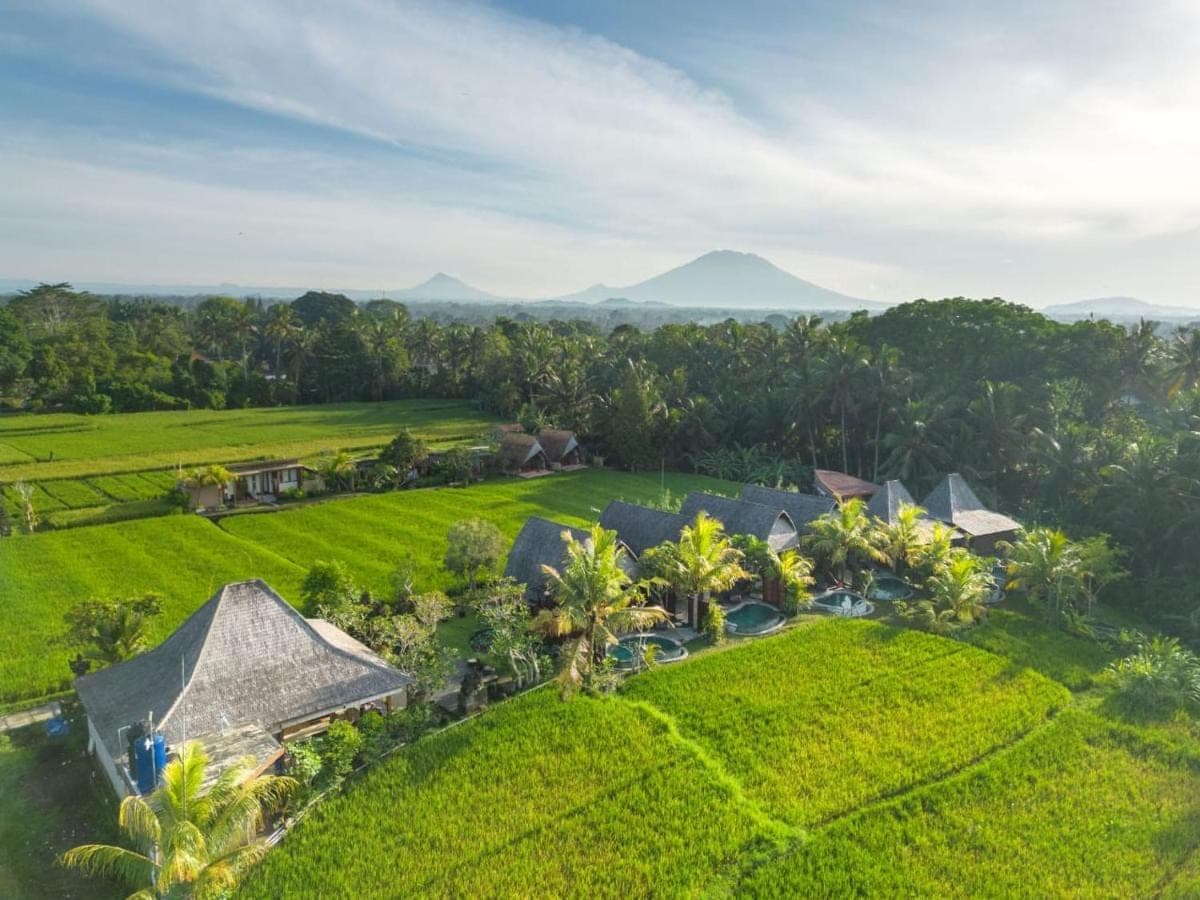 an aerial view of a house on a green field at PB Pondok Gandalangu Suite Villas Ubud Bali in Ubud