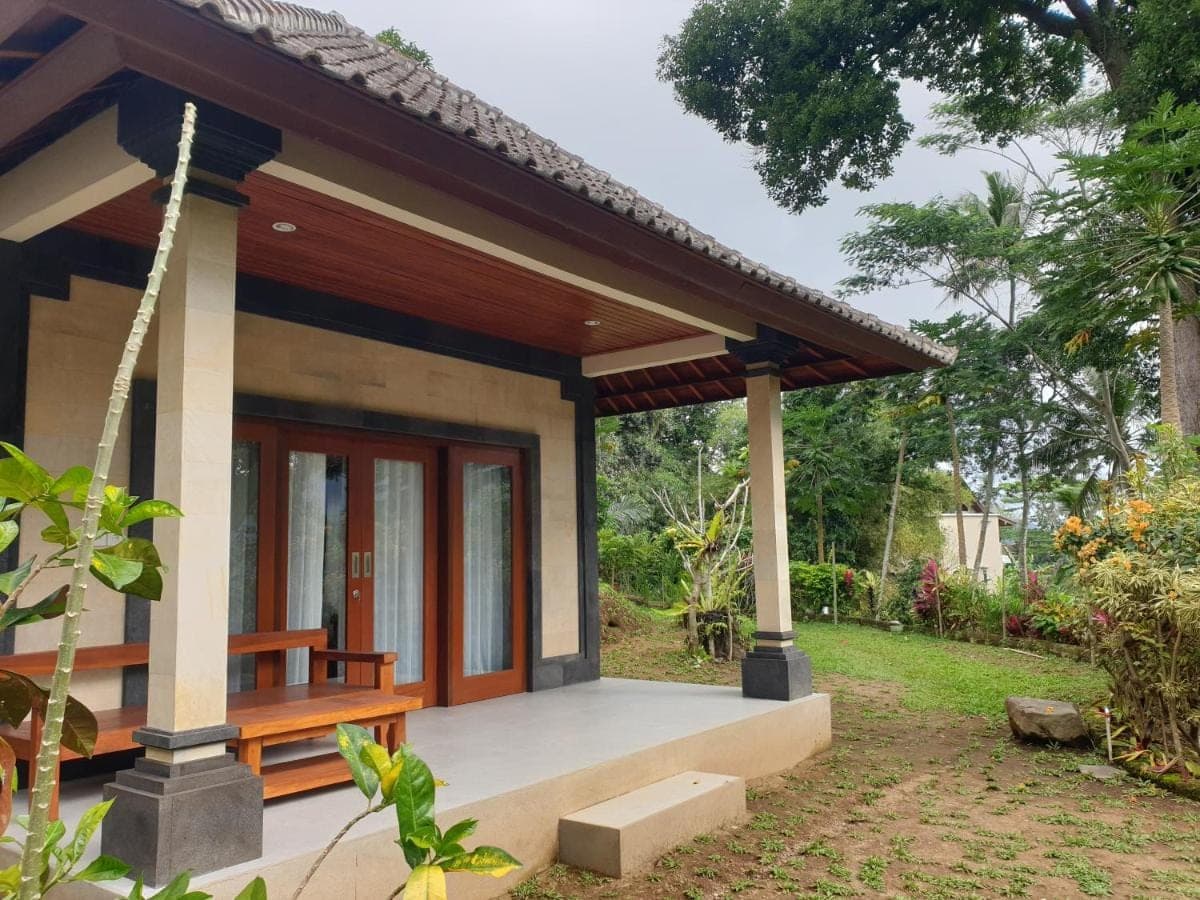 a small house with a porch at Rumah Sidemen in Sidemen