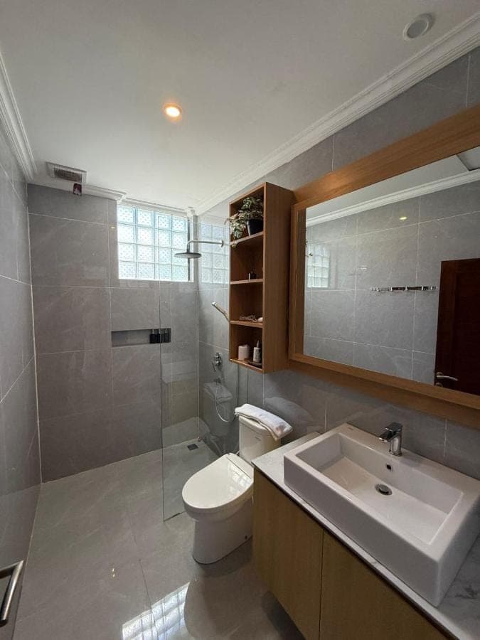 a bathroom with a toilet and a sink and a shower at Mara inn in Nusa Dua