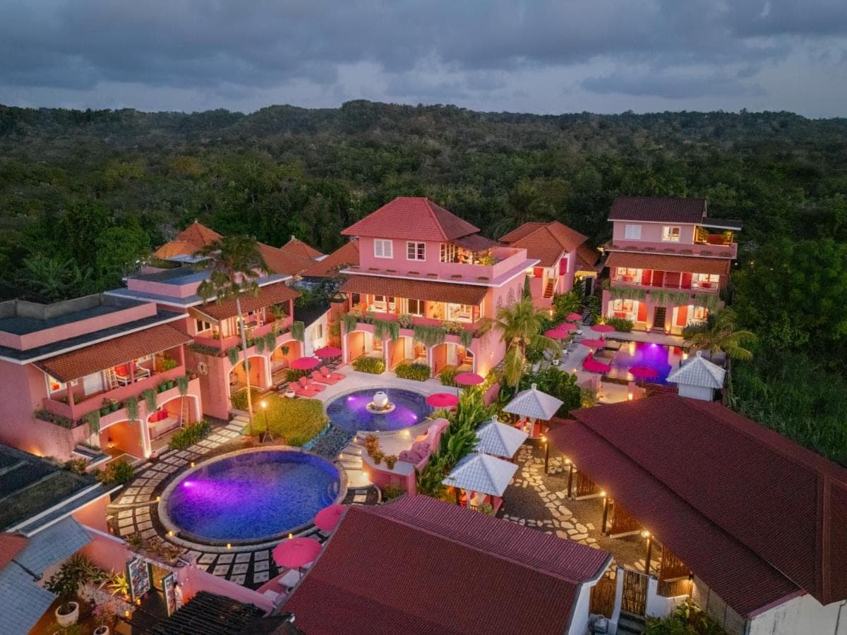 an aerial view of a resort with a swimming pool at PinkCoco Uluwatu - Constant Surprises & for Cool Adults Only in Uluwatu