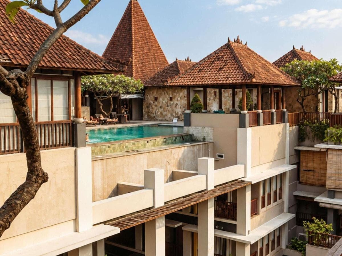 an image of a building with a swimming pool at Mercure Kuta Bali in Kuta