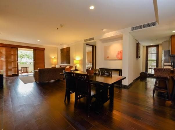 a large living room with a table and chairs at Ruby Nusa Dua Bali in Nusa Dua