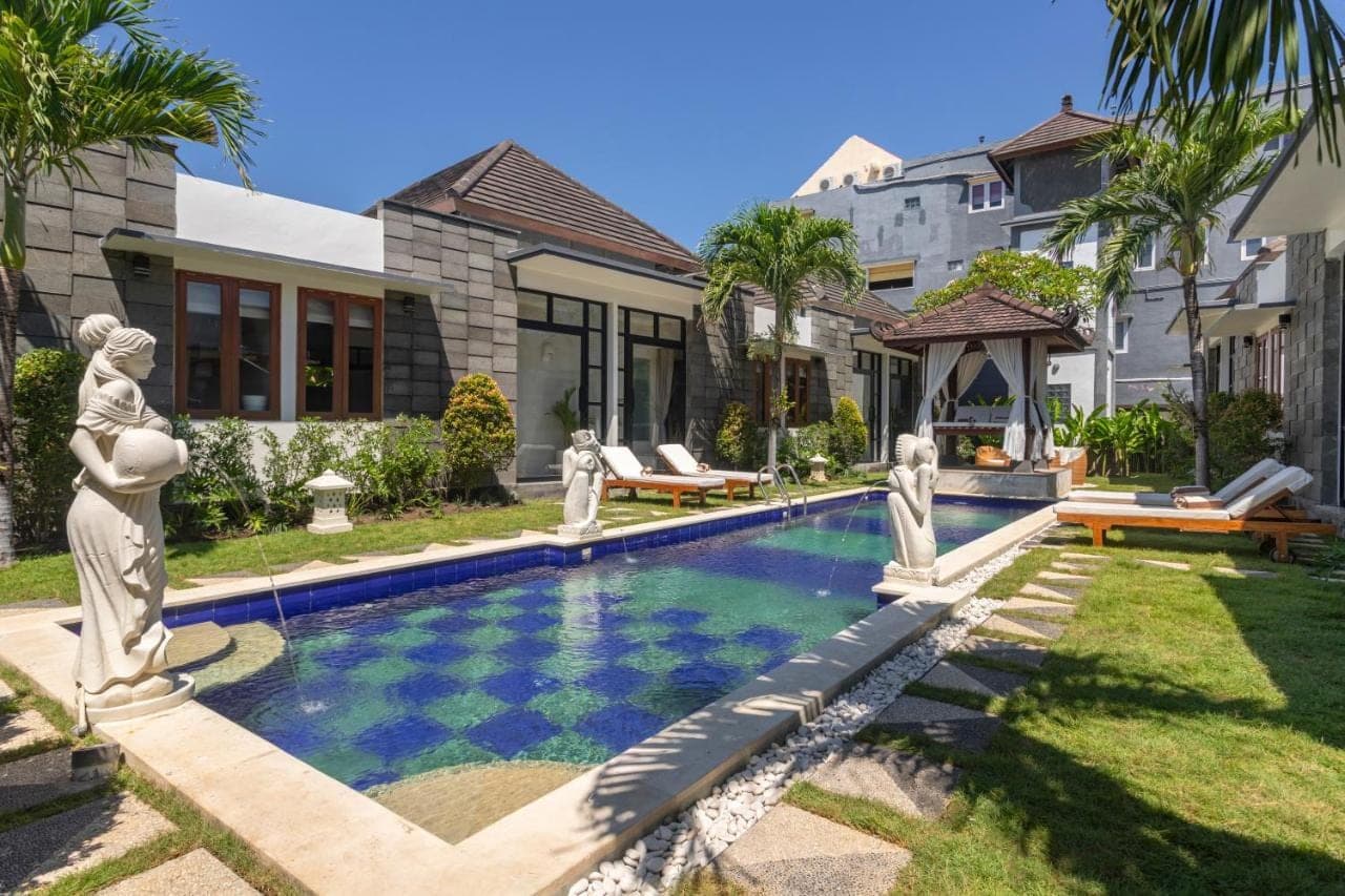 a swimming pool in the backyard of a house at Designer Studio Emy Sanur in Sanur