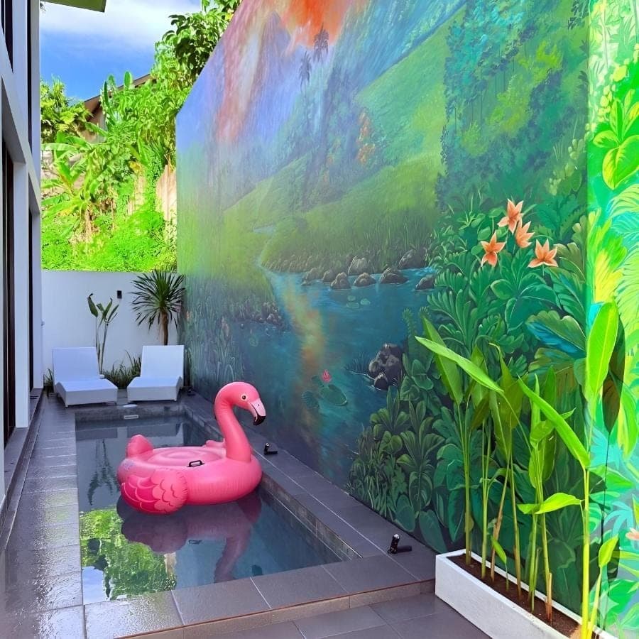 a mural of a pink flamingo in a pond at Sun on The Hill By Betterplace in Nusa Dua