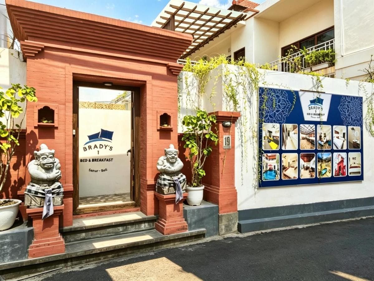 a store front with statues on the side of a building at Brady's B&B Close To Sanur Beach in Sanur