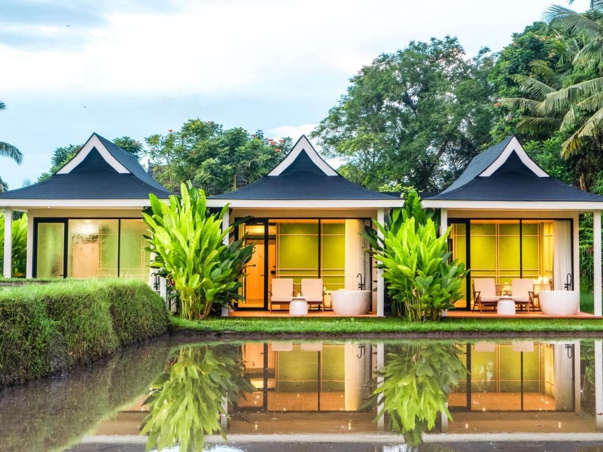 a villa with a pool in front of a house at Tanada Resort Ubud by Amithya - Brand New Opened 2026 in Ubud