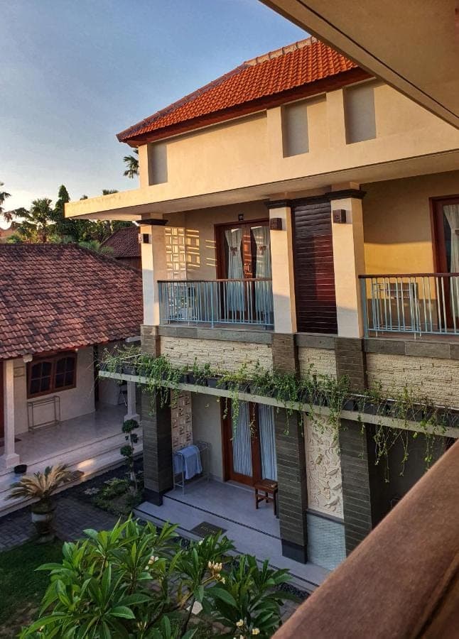 an aerial view of a house with a balcony at Kalih Homestay Bali in Kuta