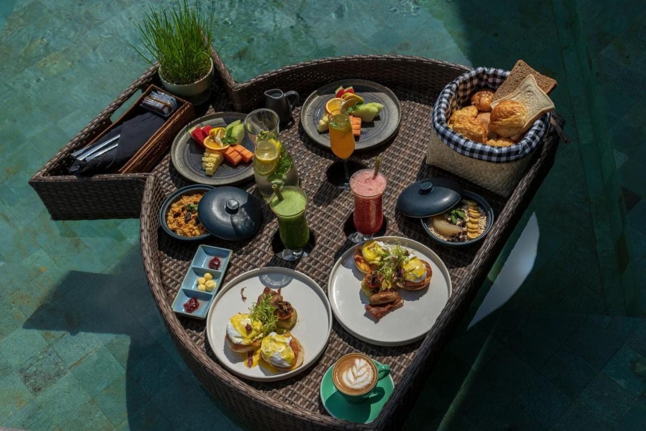 a table with plates of food and drinks on it at The Wapa Lux Tent in Sidemen