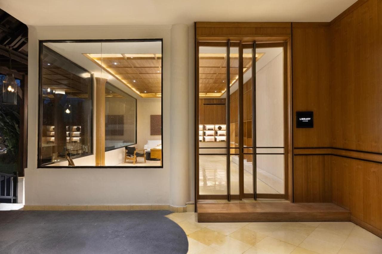 an entrance to a building with a large glass door at Sadara Resort in Nusa Dua