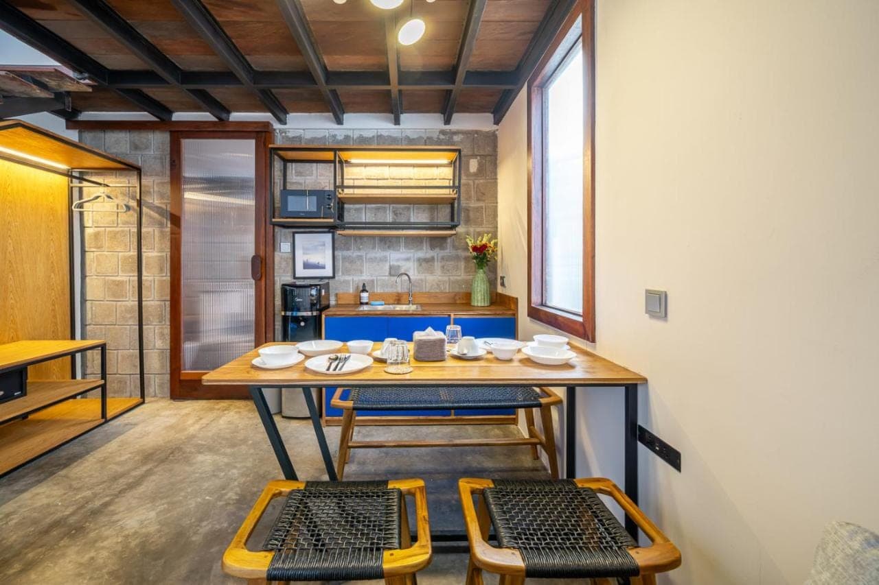 a dining room with a table and two chairs at First 5 Loft near Seminyak in Seminyak