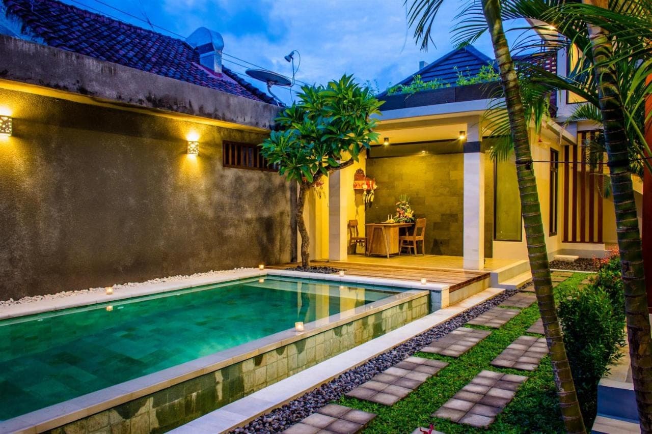 a swimming pool in the backyard of a house at Valka Bali Boutique Hotels in Seminyak