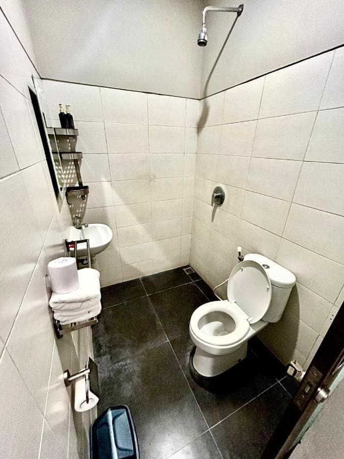 a bathroom with a toilet and a sink at Valka Bali Boutique Hotels in Seminyak