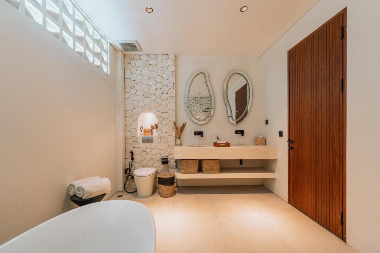 a bathroom with a sink and a mirror at Adaya Boutique Villas in Uluwatu