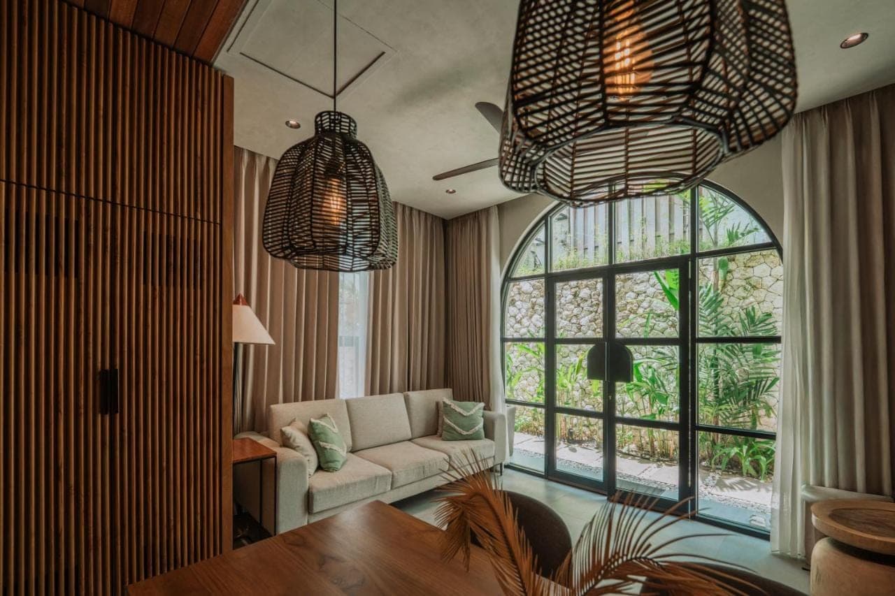 a living room with a couch and a table at Adaya Boutique Villas in Uluwatu