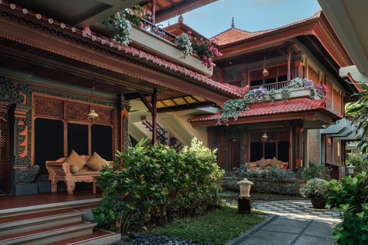 a house with a couch on the porch at Bali Tropic Resort & Spa - CHSE Certified in Nusa Dua