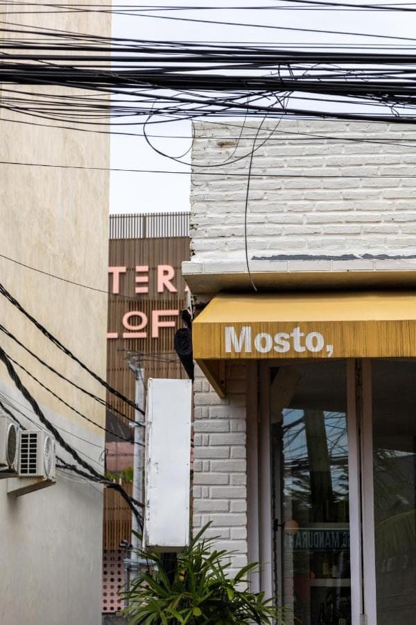 a store with a sign on the side of a building at Atera Loft Canggu in Canggu