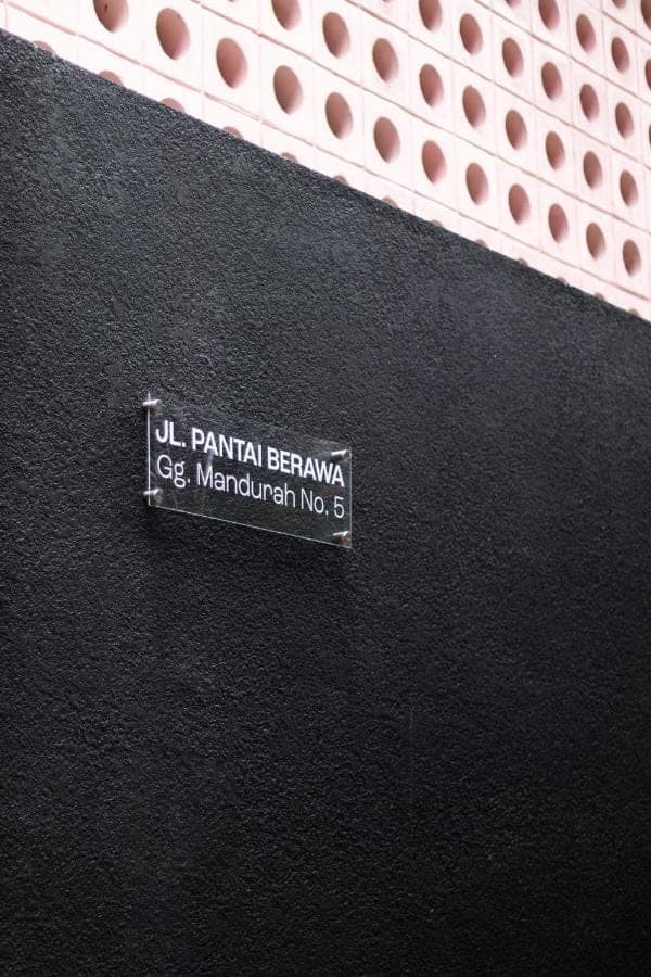 a sign on the side of a building at Atera Loft Canggu in Canggu