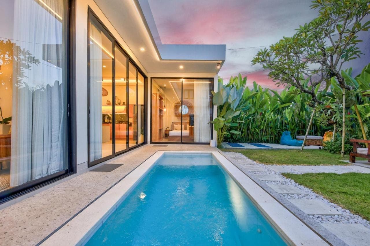 a swimming pool in the backyard of a house at Soul Garden Villa Nusa dua in Nusa Dua