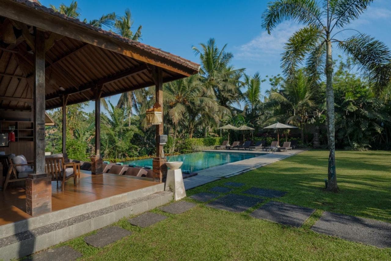 a villa with a swimming pool in a resort at Pertiwi Bisma Ubud in Ubud