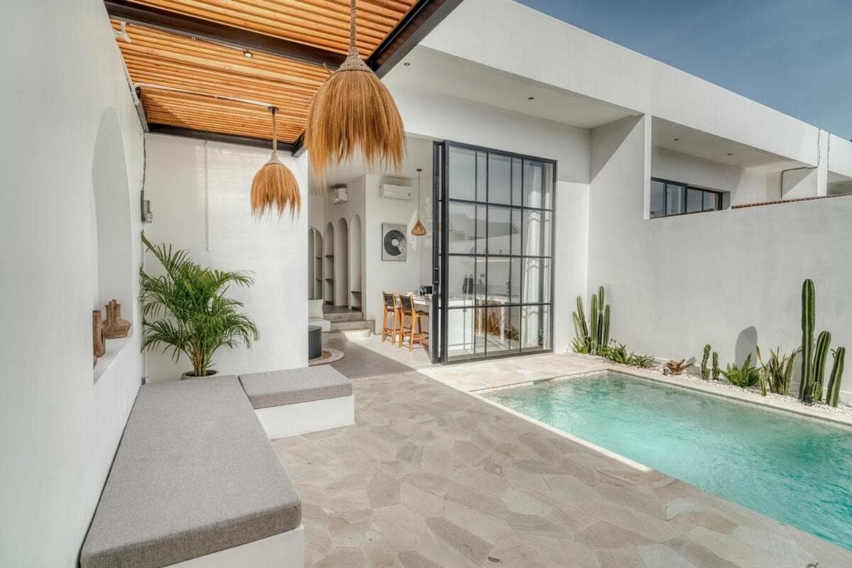 a swimming pool in the middle of a house at Avasa Villas - Brand New 1BR Luxury in Canggu in Canggu
