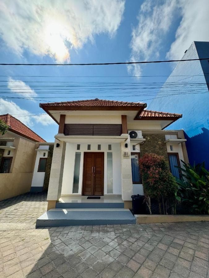 a small house with a blue at Lily House Cozy 2 bedrooms Villa with Pool in Bukit in Nusa Dua